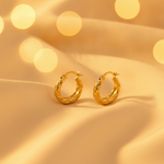 Load image into Gallery viewer, GER134. 14K Gold Twisted Hollow Hoop Earrings