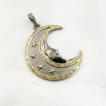 Load image into Gallery viewer, A two-tone (black rhodium and gold plated) silver pendant in the shape of a crescent moon with stars, featuring diamond accents.