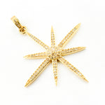 Load image into Gallery viewer, A collection of star-shaped diamond pendants in silver, black rhodium, gold, and rose gold finishes.