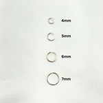Load image into Gallery viewer, Sterling Silver Open Jump Rings 18 Gauge 7mm. 5004524
