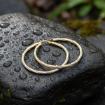 Load image into Gallery viewer, GER71. 14K Gold Hollow Hoop Earrings with Engraved Tornado Design