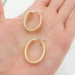 Load image into Gallery viewer, 14K Gold Smooth and Textured Oval Hollow Hoop Earrings