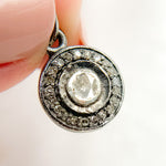 Load image into Gallery viewer, A sterling silver round charm with a central polki diamond, surrounded by a border of black rhodium with gold plating.