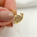 Load image into Gallery viewer, A sterling silver snail charm with black rhodium and gold plating, adorned with pave set diamonds and a small gemstone.