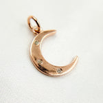 Load image into Gallery viewer, A sterling silver moon pendant with black rhodium and rose gold plating, featuring small diamond accents.