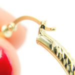 Load image into Gallery viewer, GER67. 14K Gold Hollow Hoop Earrings with Engraved Tornado Design