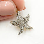 Load image into Gallery viewer, A gold-plated starfish pendant with diamond accents on a white background.