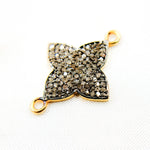 Load image into Gallery viewer, A sterling silver connector with a black rhodium flower design and gold plating detail, with a visible gold wire loop at the back.