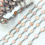 Load image into Gallery viewer, Coated Peach Moonstone Round Shape Bezel Oxidized Wire Chain. CMS17
