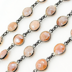 Load image into Gallery viewer, Coated Peach Moonstone Round Shape Bezel Oxidized Wire Chain. CMS110