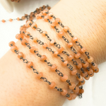 Load image into Gallery viewer, Peach Moonstone Wire Wrap Chain made with Black Rhodium Plate 925 Sterling Silver. MS36