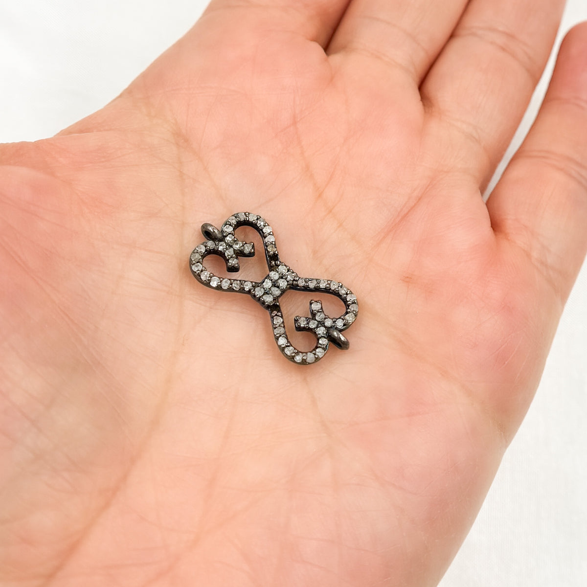 DC187. Diamond & Sterling Silver Bow Connector