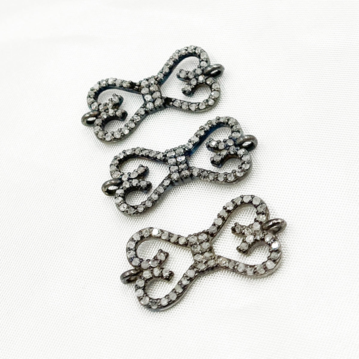 DC187. Diamond & Sterling Silver Bow Connector