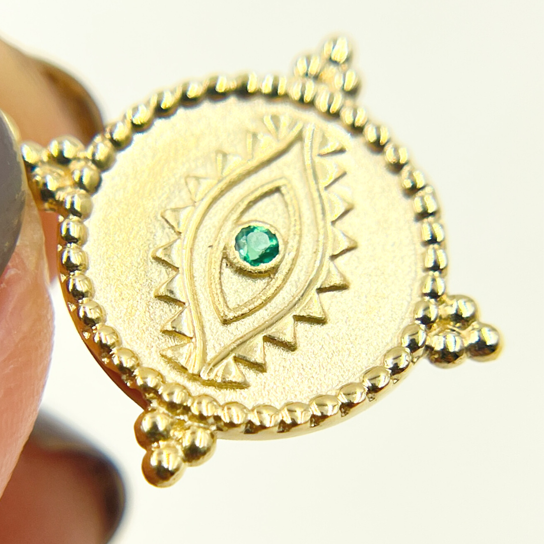 Buy Gold Round Eye Charm with Gemstones