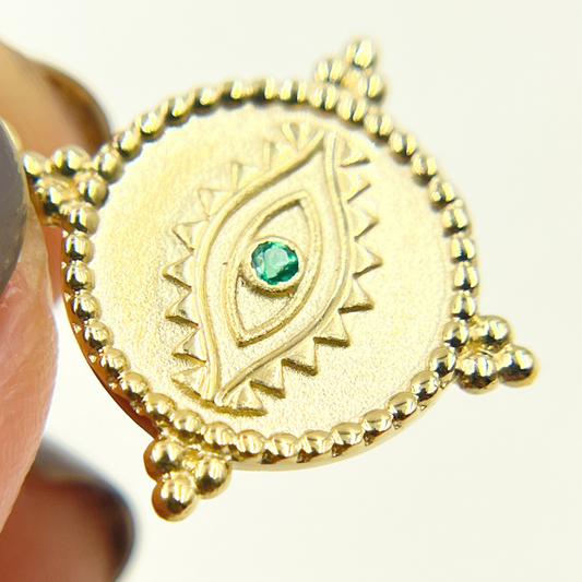 Buy Gold Round Eye Charm with Gemstones