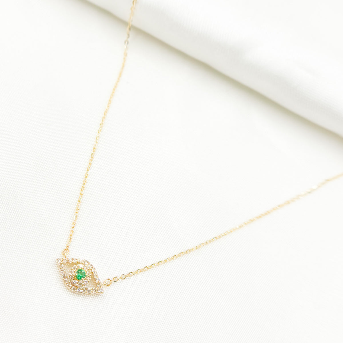 NFC71609EM. 14K Solid Gold Diamond and Emerald Eye Necklace
