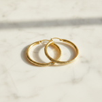 Load image into Gallery viewer, GER67. 14K Gold Hollow Hoop Earrings with Engraved Tornado Design