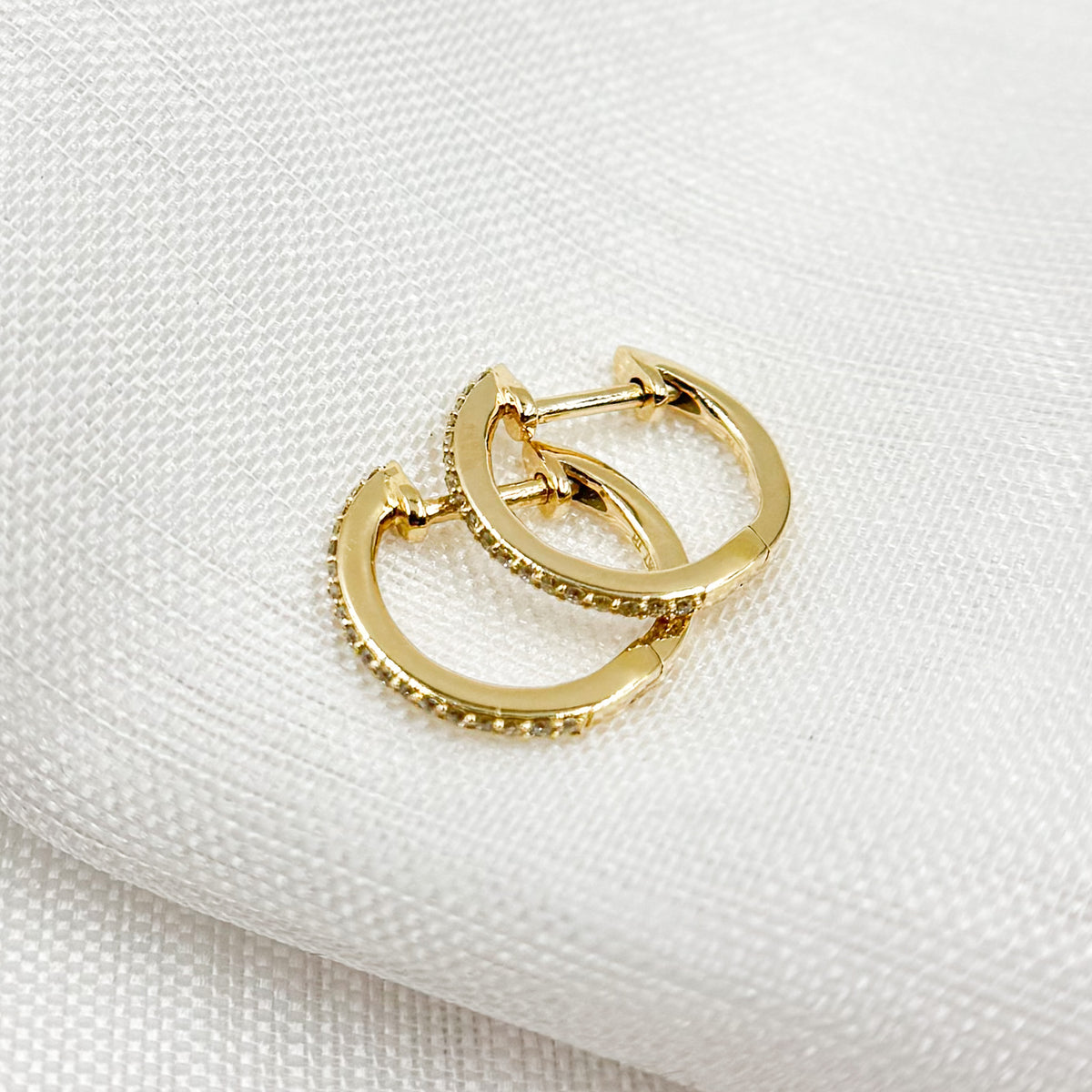 HP115334. 14K Solid Gold Diamond Huggies