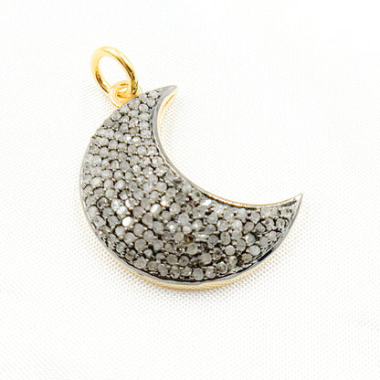 Two diamond-studded sterling silver moon pendants with black rhodium and gold plating, displayed against a white background.