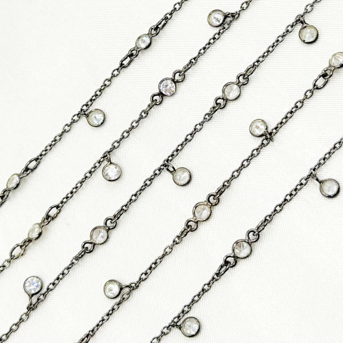 Cubic Zirconia Round Shape Dangle and connected Wire Chain.