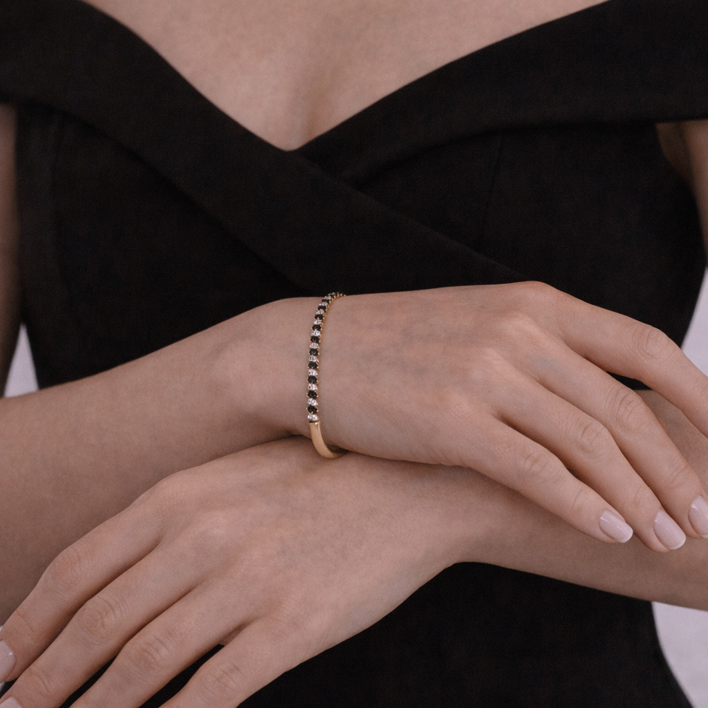 BNK68620A. 14K Solid gold bangle alternating black diamonds and white diamonds