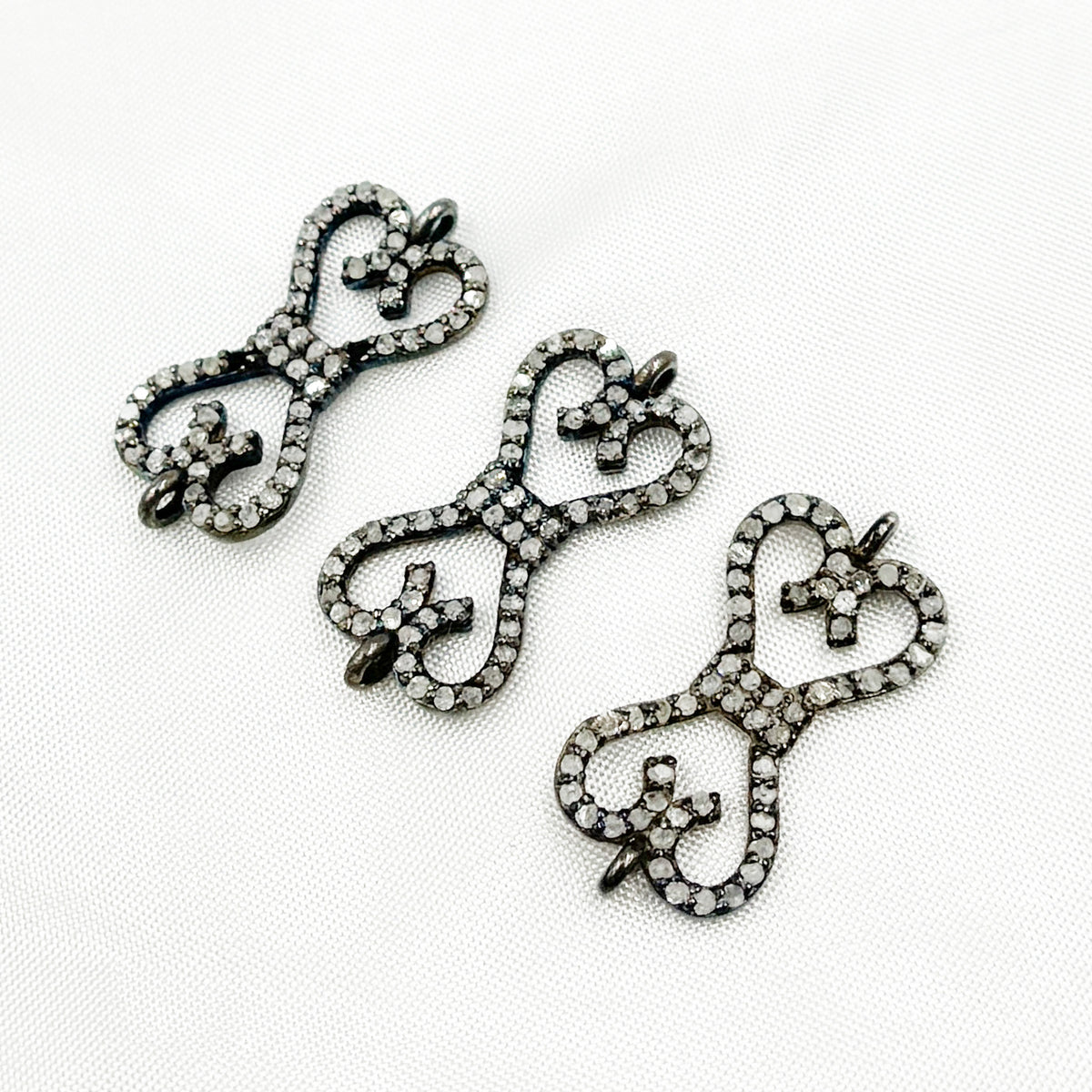 DC187. Diamond & Sterling Silver Bow Connector
