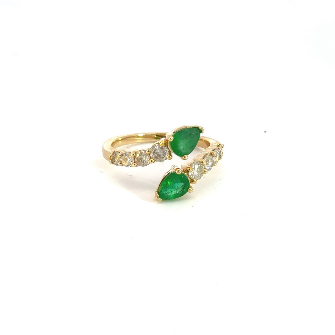 14k Solid Gold Spiral Diamond and Emerald Ring.