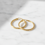 Load image into Gallery viewer, GER173. 14K Gold Hollow Hoop Earrings with Engraved Tornado Design