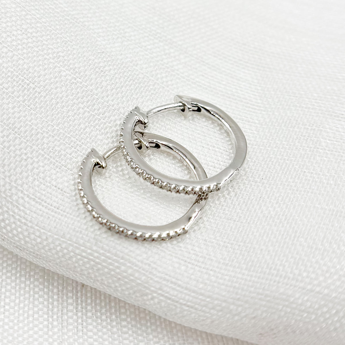 HP115374. 14K Solid Gold Diamond Huggies