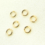 Load image into Gallery viewer, 14K Gold Filled Open Jump Ring 28 Gauge 3mm. MFT030DE28GF
