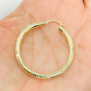 GER67. 14K Gold Hoop Earrings with Engraved Tornado Design