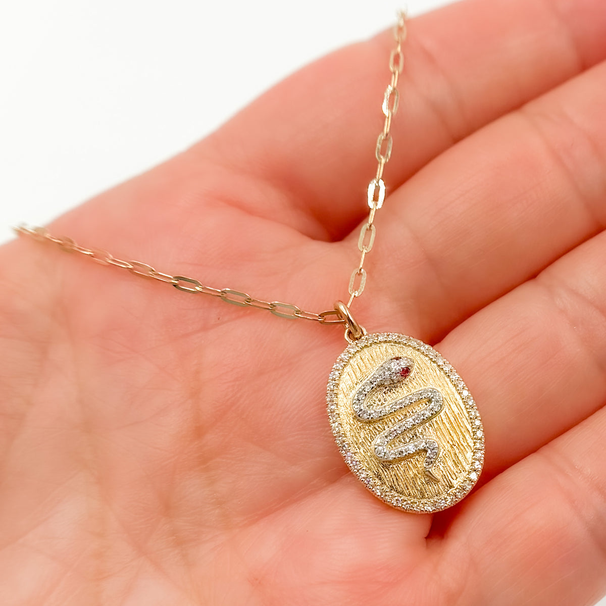 NFD72328RU. 14k Solid Gold Diamond and Ruby Oval Snake Necklace