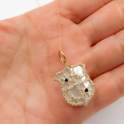 Shop Now  Gold Shield Pendant