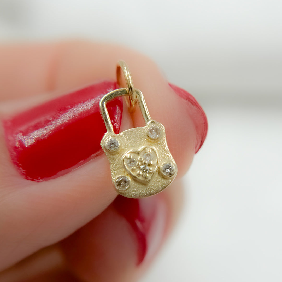 14K Solid Gold with Diamond Lock Charm with Heart in the Center. GDP553